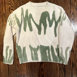 white sweater with green detailing